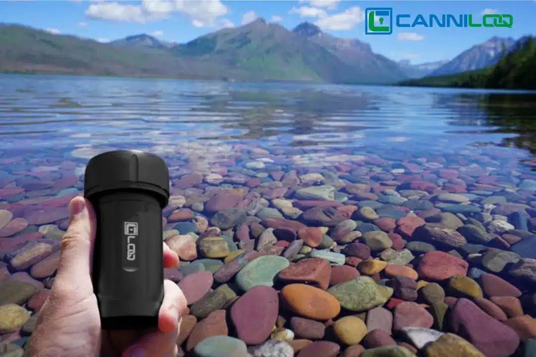 a black canniloq waterproof herb storage container shown on flathead lake montana