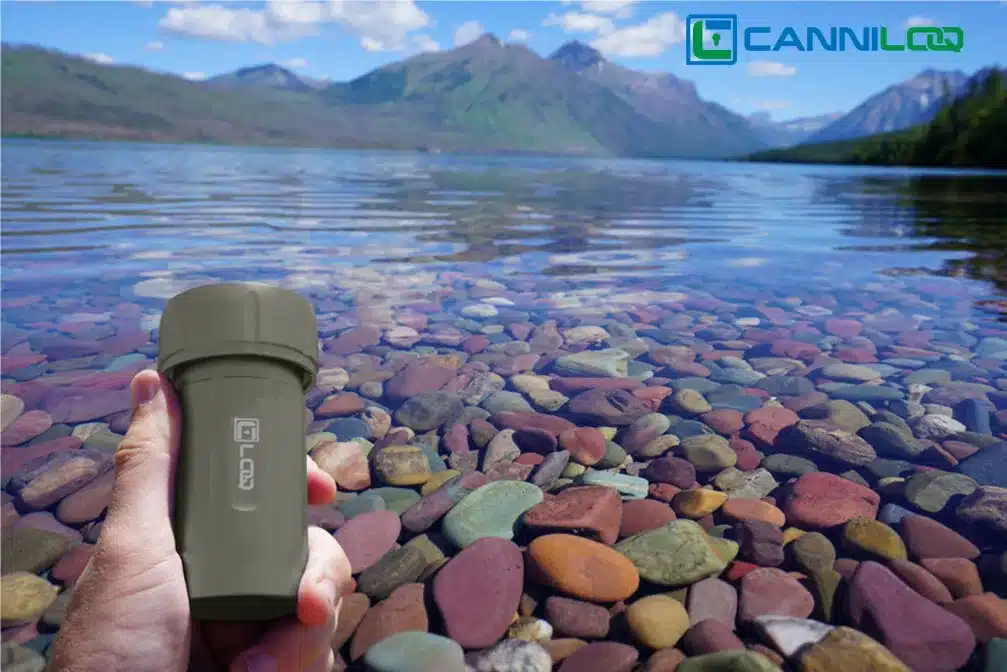a gray canniloq waterproof herb storage container shown on flathead lake montana